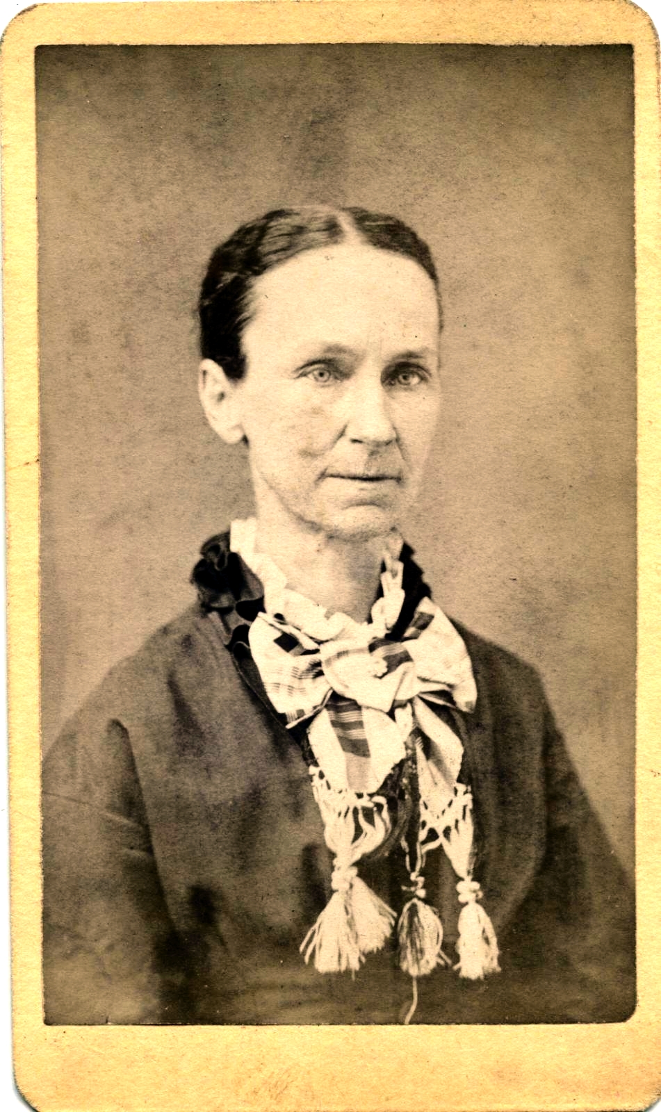 an old po of a woman wearing a scarf