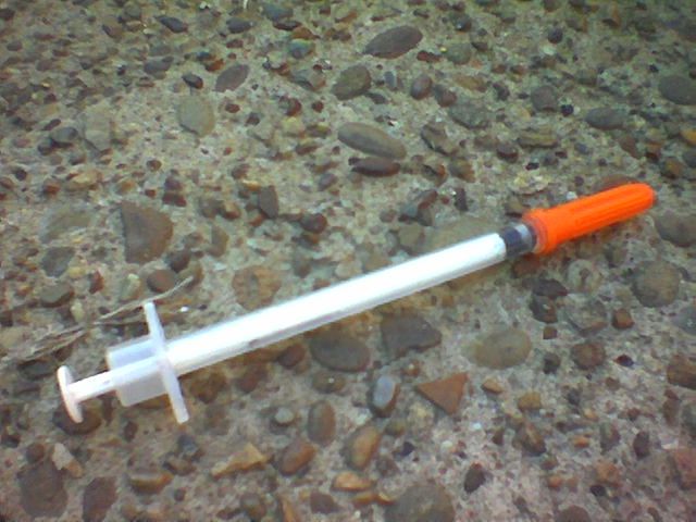 a close up image of an orange and white contraption
