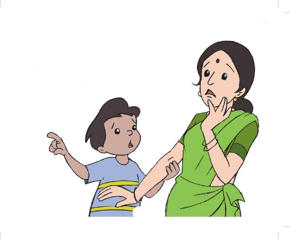 a mother pointing at her son who is standing by her