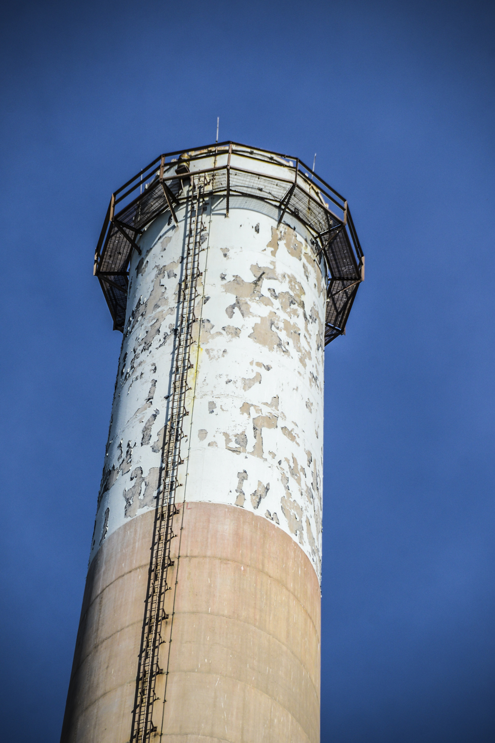 a large white tower with scaffolding on top