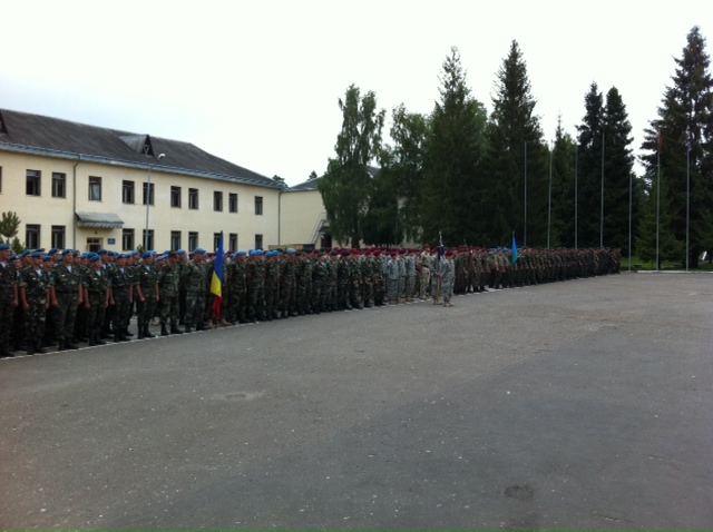 some soldiers are standing in formation for a long line