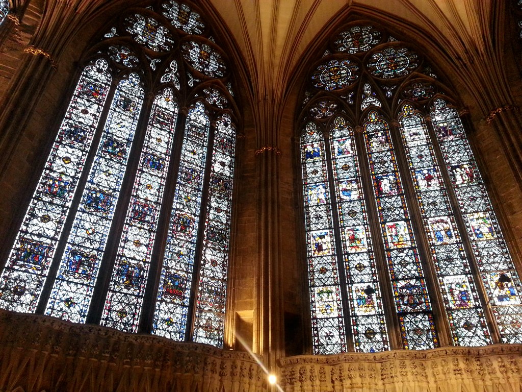 two beautiful stained glass windows in a cathedral