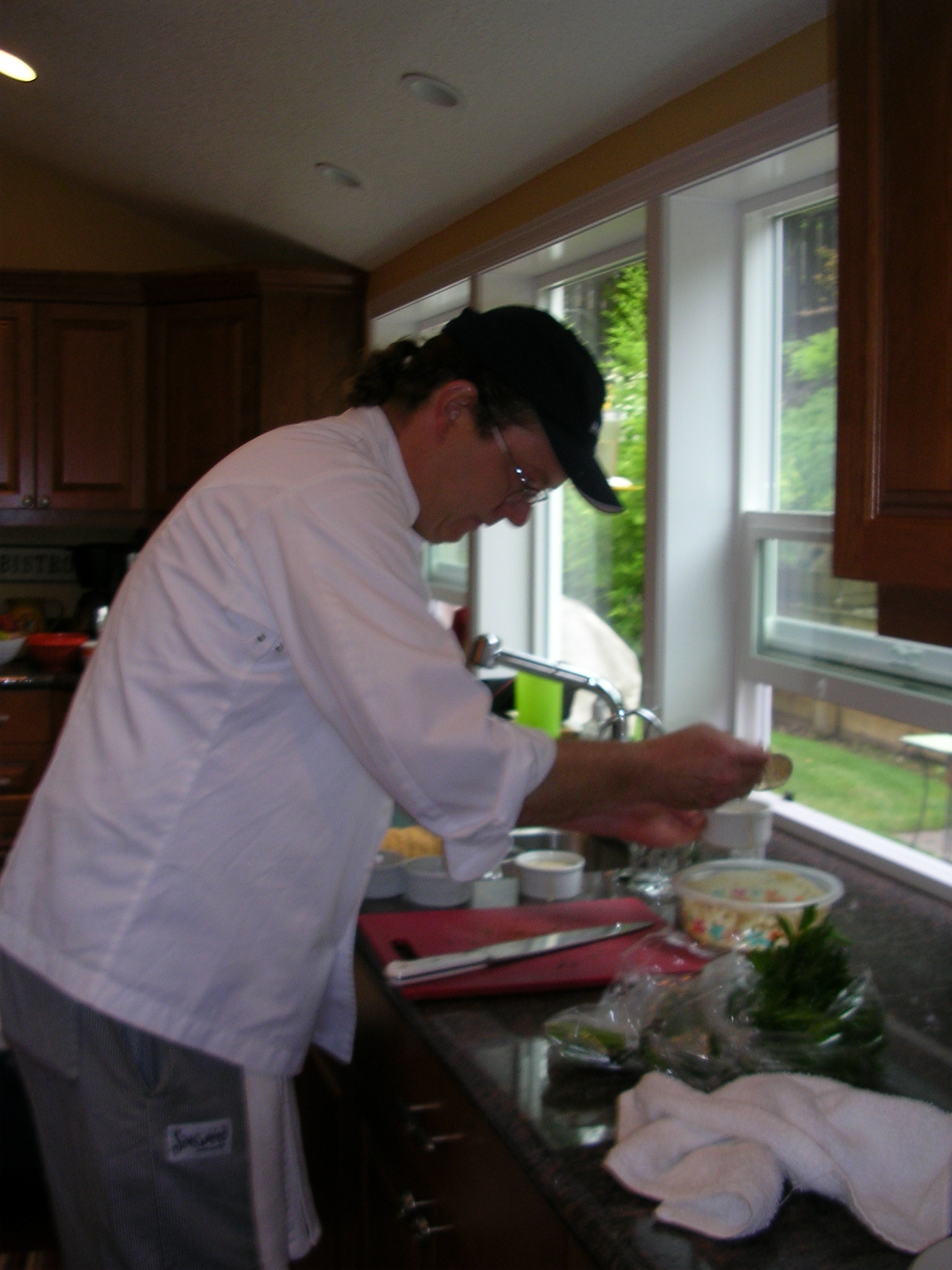 a man in a kitchen  up food