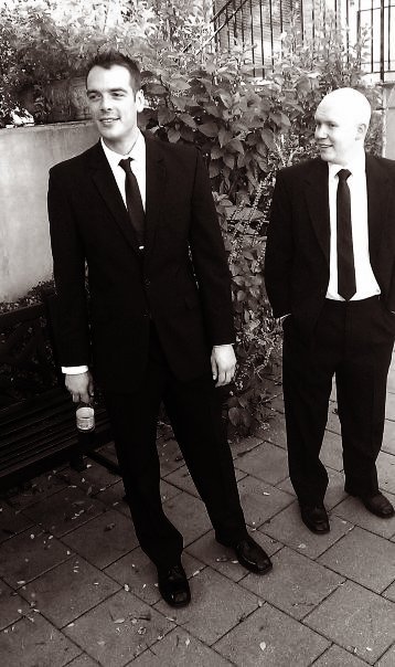 black and white pograph of men in suits