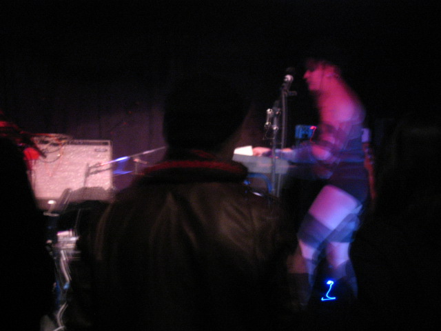 there is a man playing a keyboard on the stage