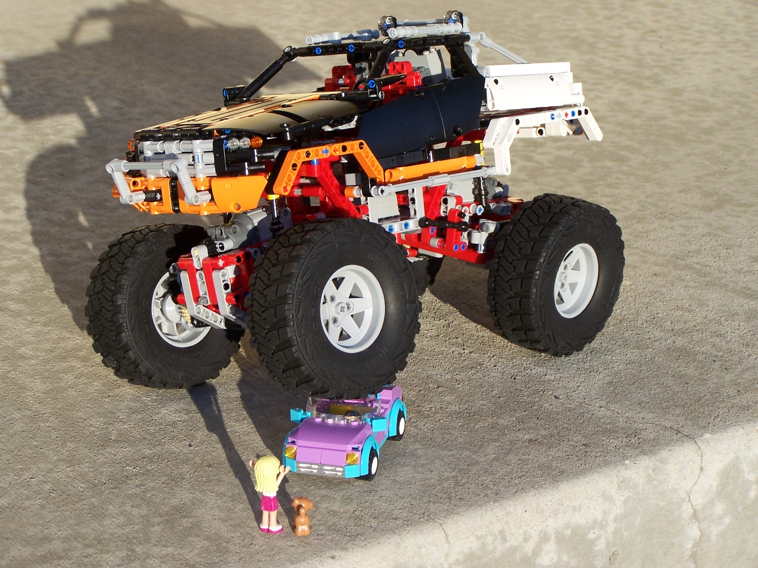 a lego toy truck with four big wheels