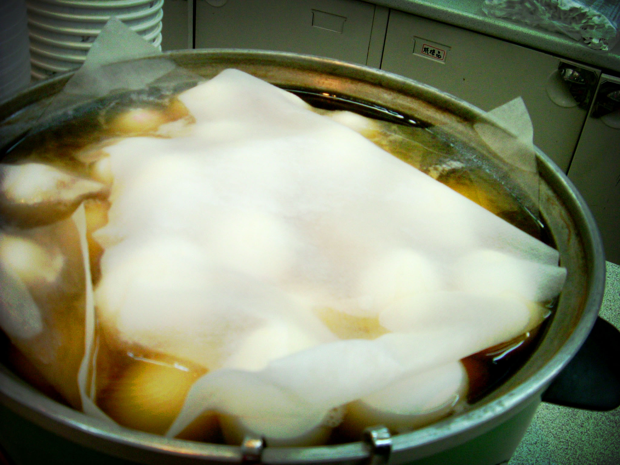 a pot full of stew with ice in it