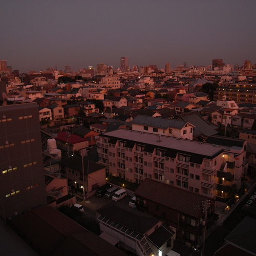 an aerial view of a city skyline at dusk