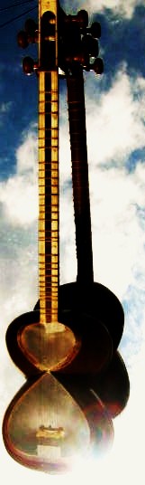 a guitar leaning against the sky, on the ground