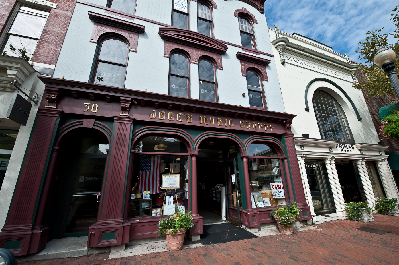 an old building with shops front, stores inside and outside