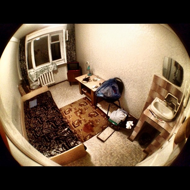 a fisheye view image of a bedroom