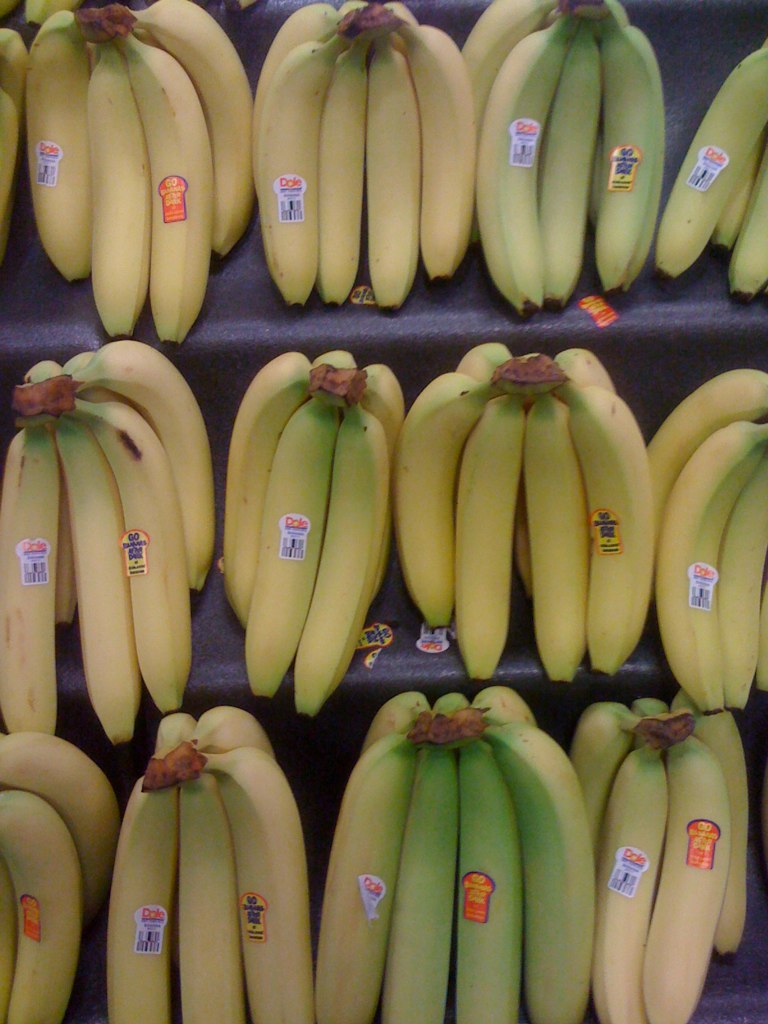 bunches of bananas on display at a store