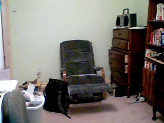 a computer desk and office chair in a room