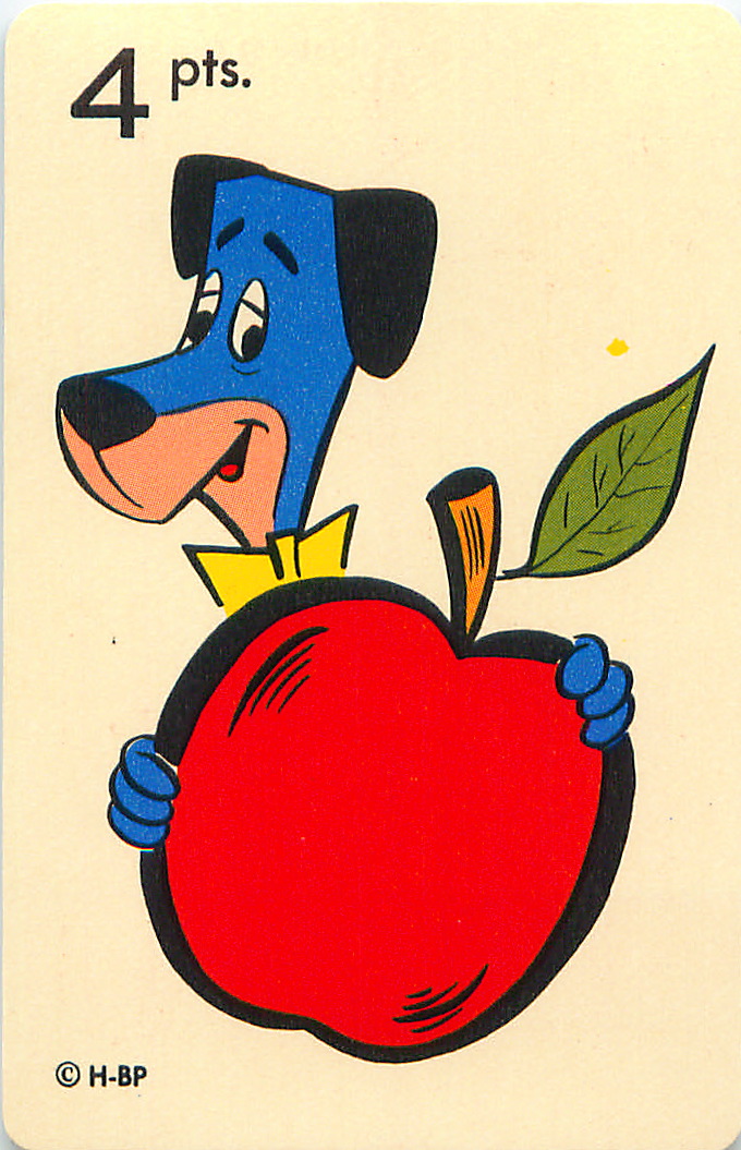 a dog in a card with an apple