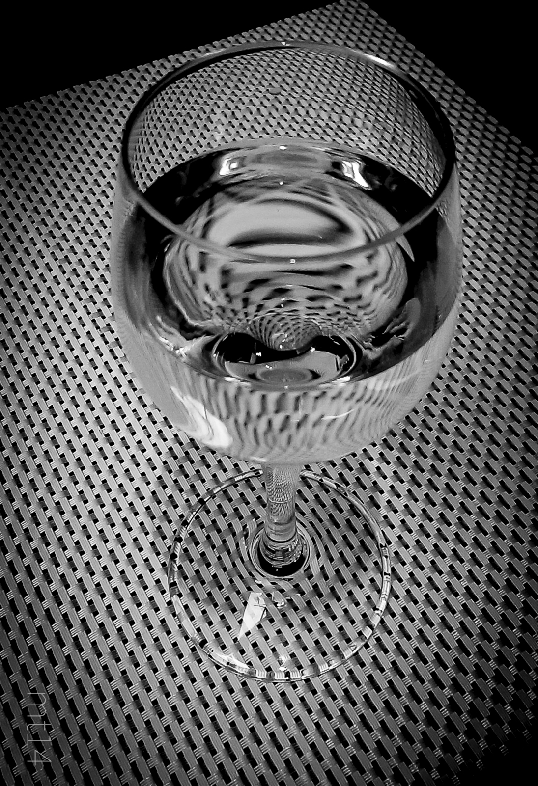 a black and white po of a wine glass