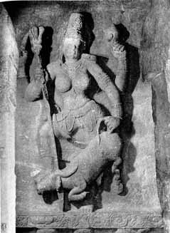 the carved statue of woman is seen on a wall