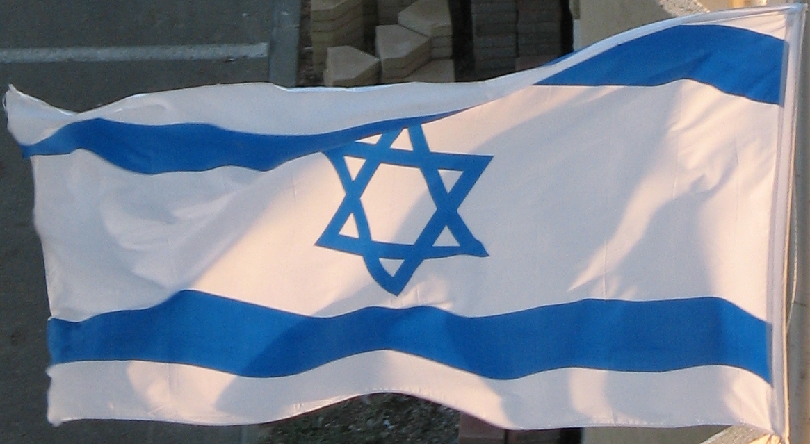 a large blue and white flag on a pole