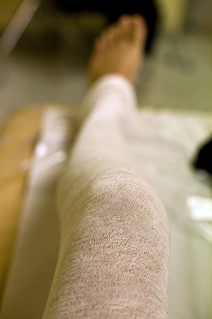 the leg is covered by a cast while sitting
