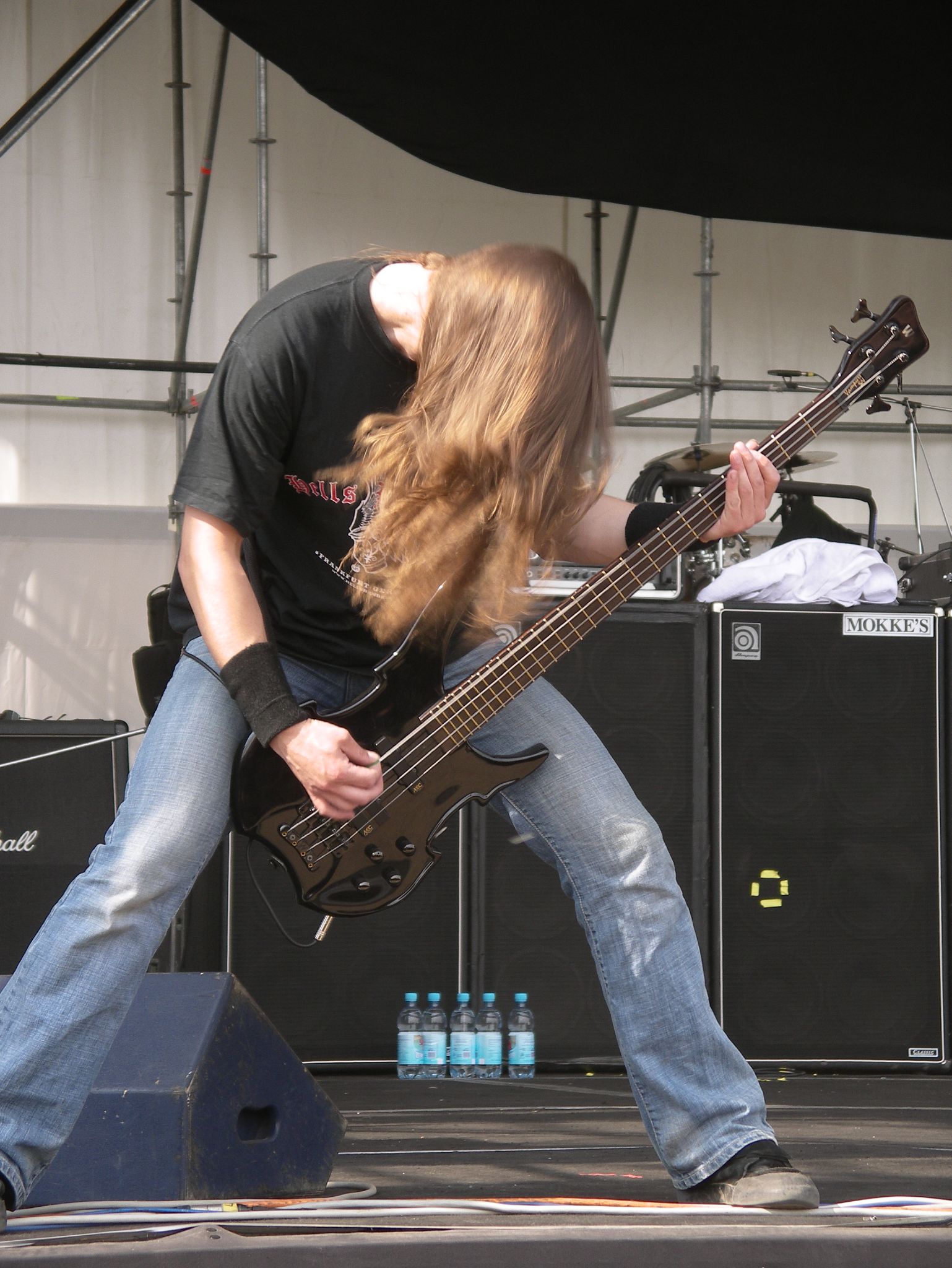 an image of man playing bass on stage