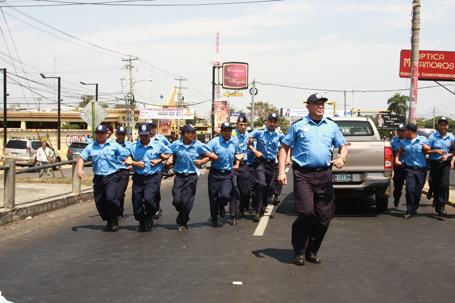 the police man are marching down the street