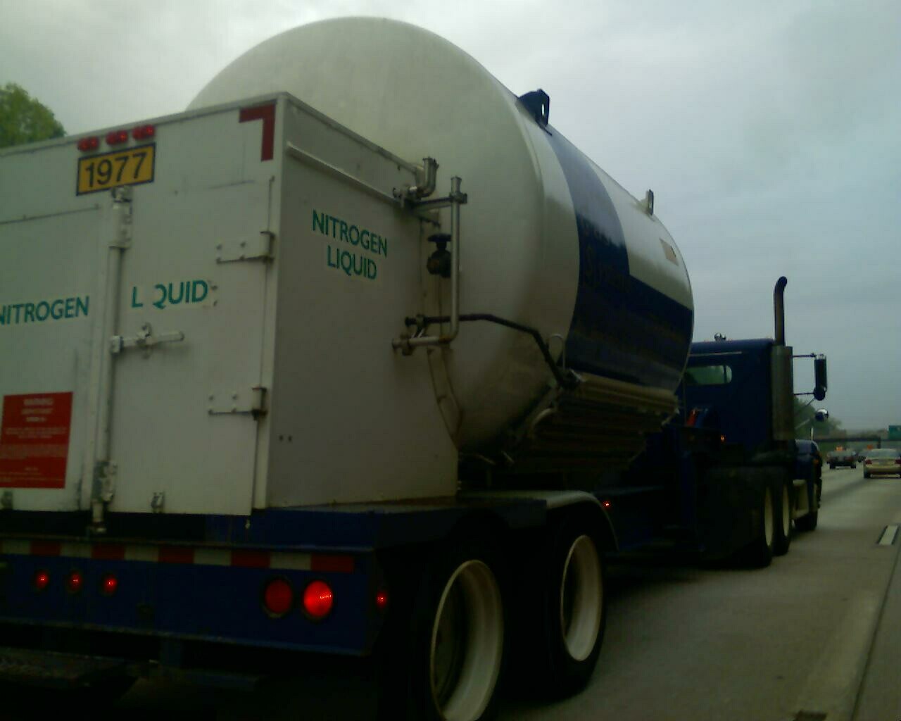the truck is carrying a large tanker
