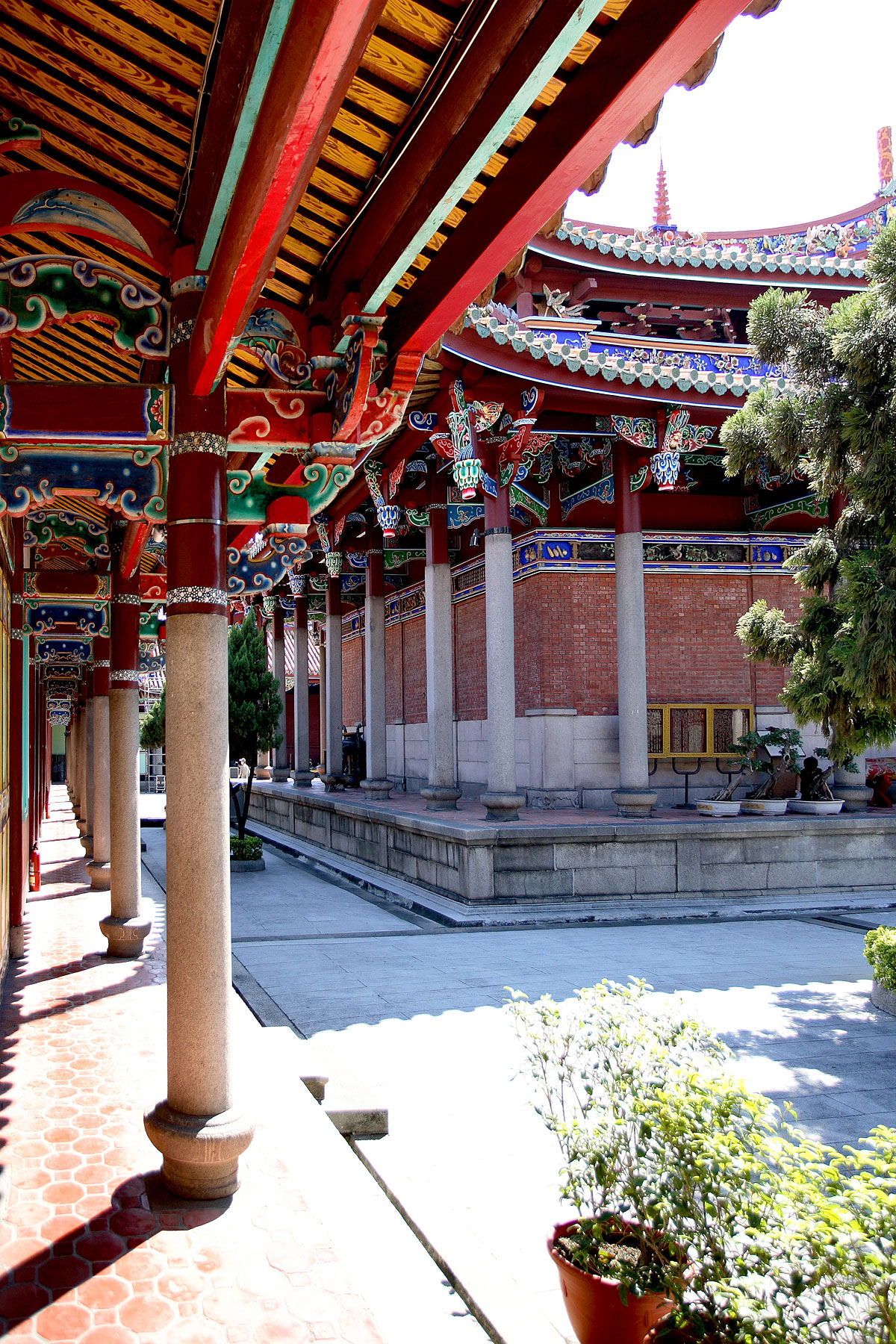 an outdoor patio with various buildings and trees in the background