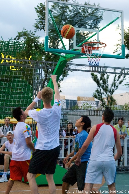 a group of men playing a game of basketball