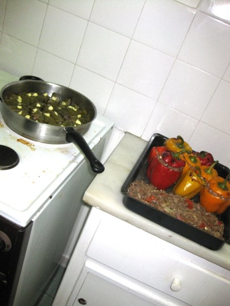 three different dishes on the counter with one dish with food and one with peppers