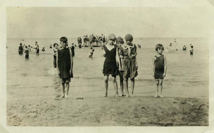 some very old people by some water and a beach