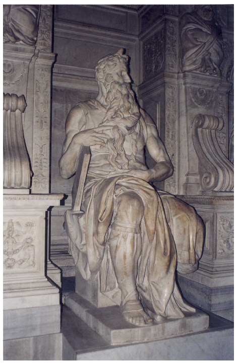 an image of a statue that looks like he is writing