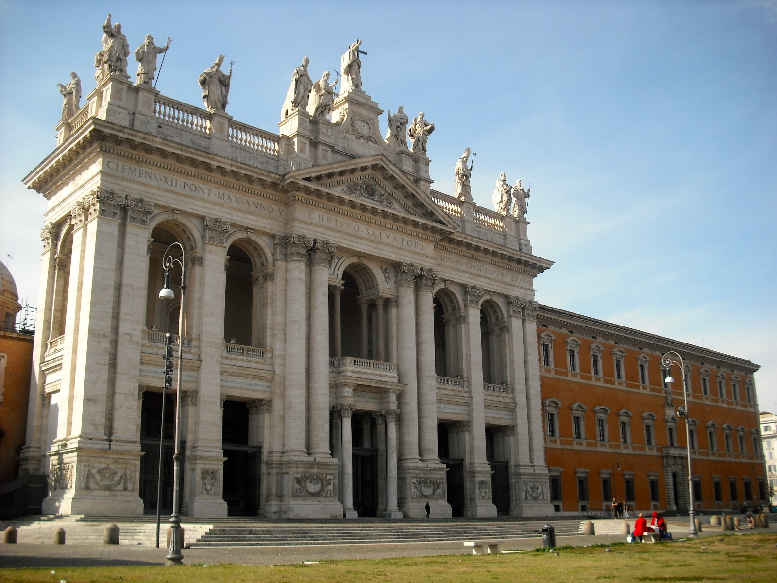 an ornate building is sitting in front of a large building