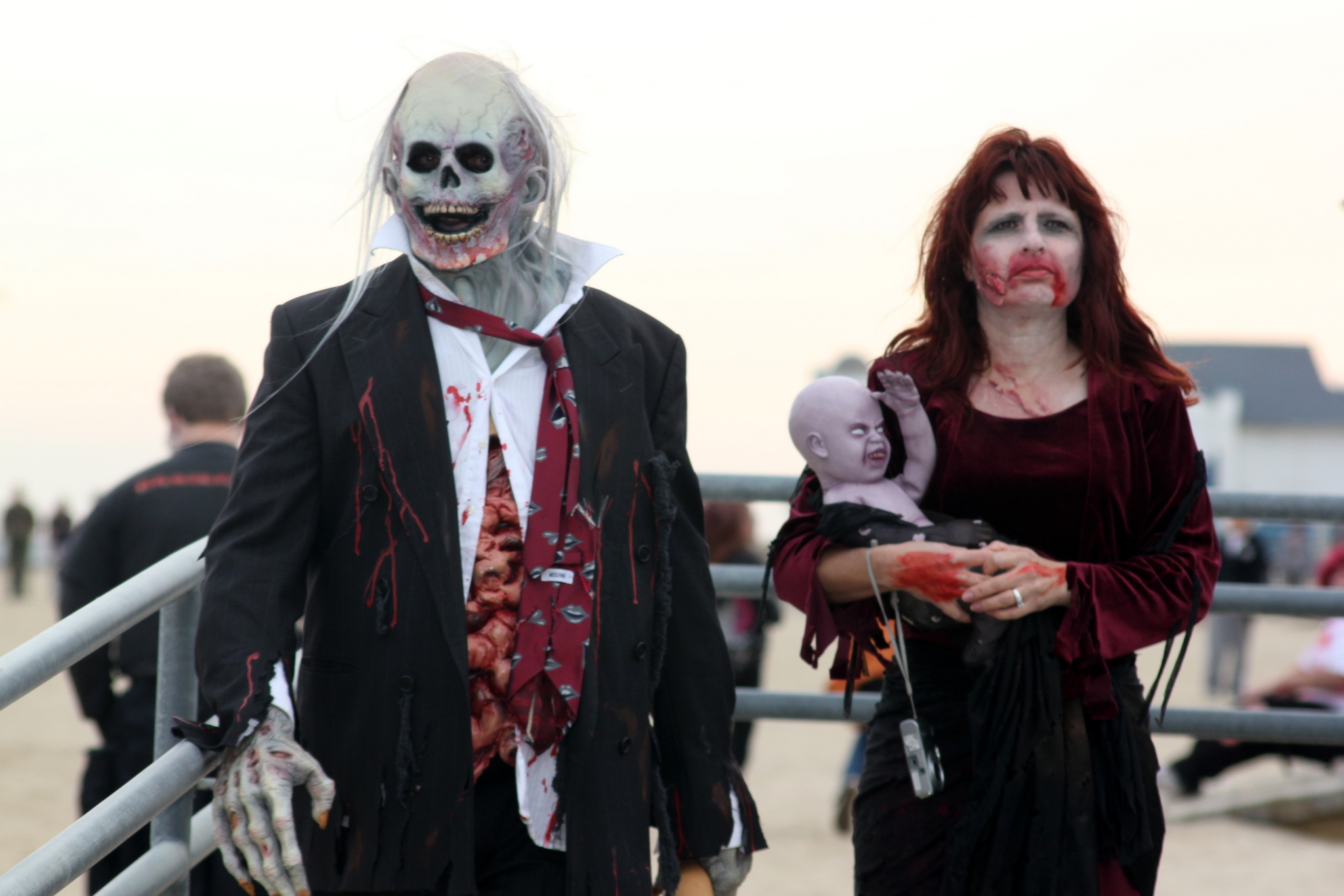 a couple of people in costumes on the beach