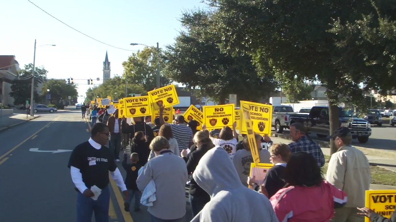 a group of people that are standing in the street