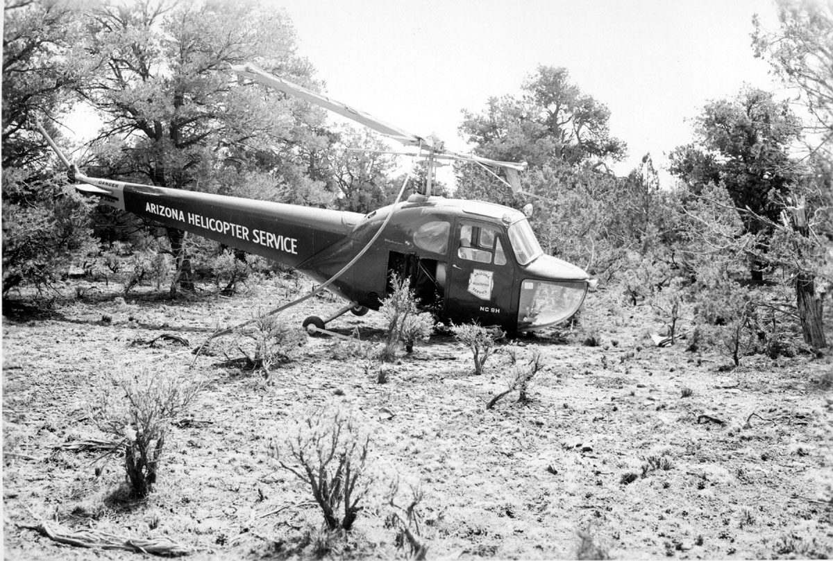 a helicopter sitting in the middle of the desert