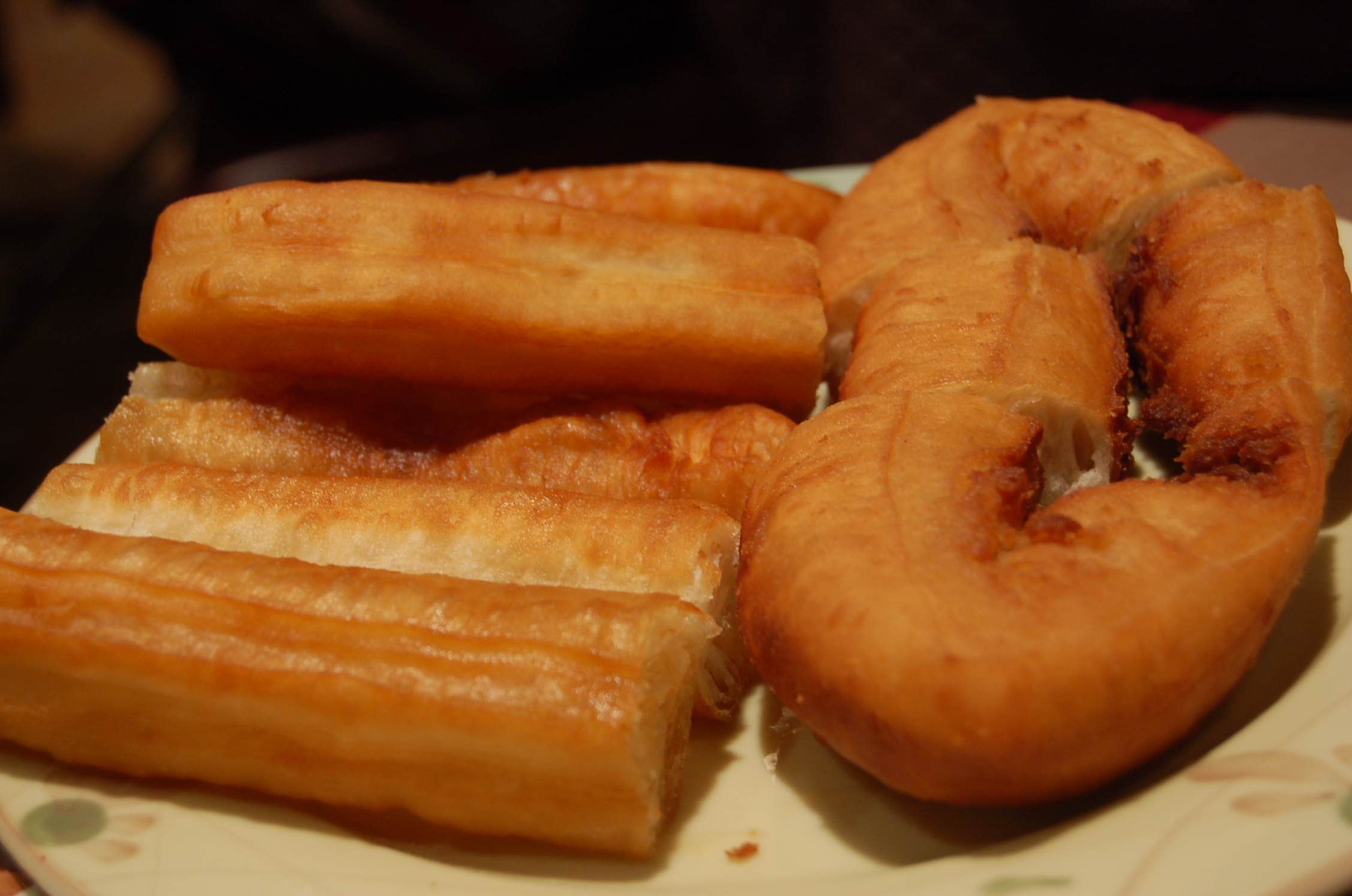 there are six glazed doughnuts sitting on the plate