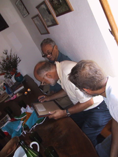 three men are doing work in an apartment