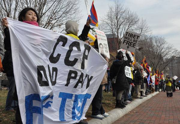 people are protesting during a march with banners and a banner reading ccp did pay fat?