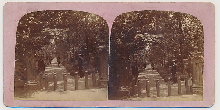 an old - fashioned po of two cemetery gates