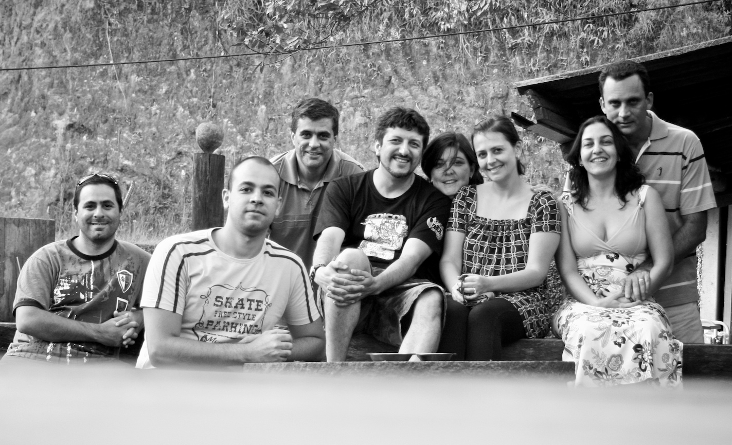 a family of six sitting on the steps of a building