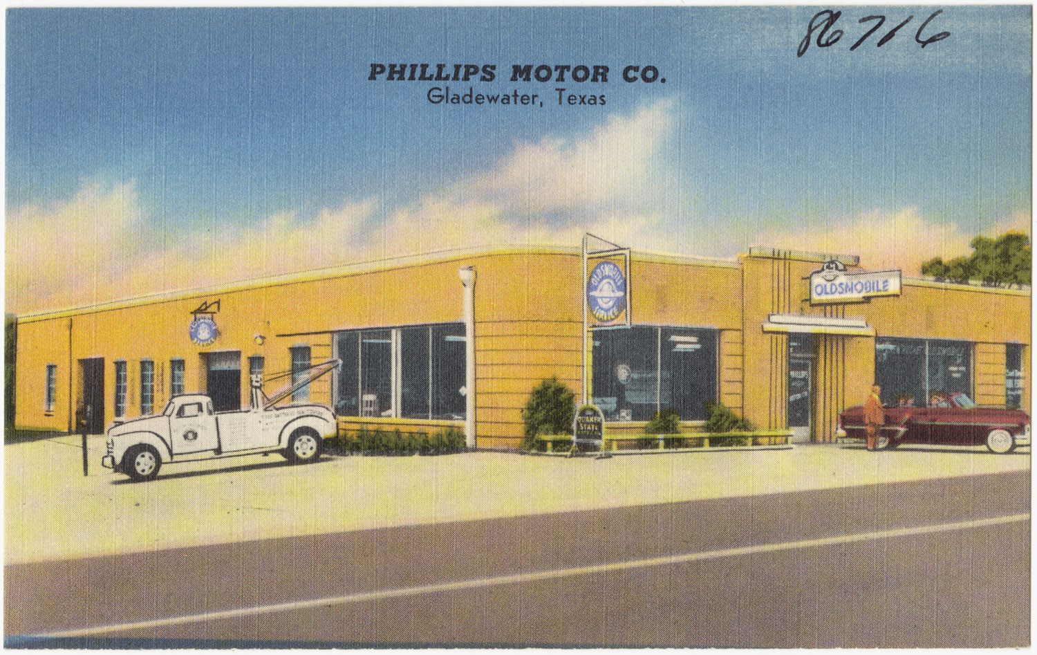 an old time postcard of phillips motor company