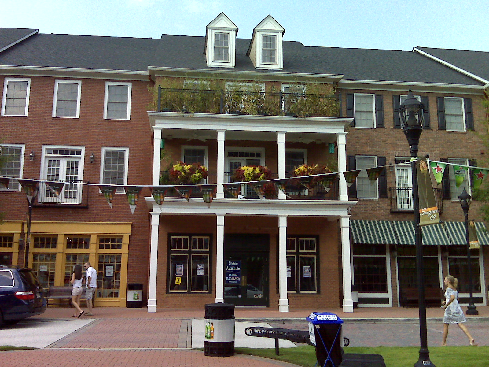 there are people walking near an old fashioned building