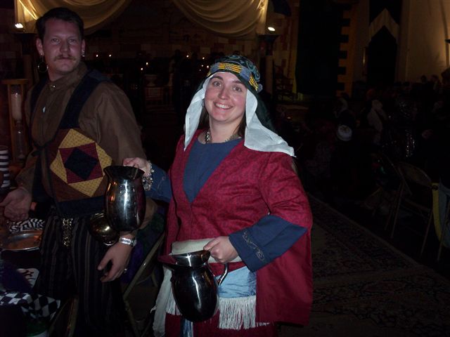 a man and woman dressed up in medieval costumes