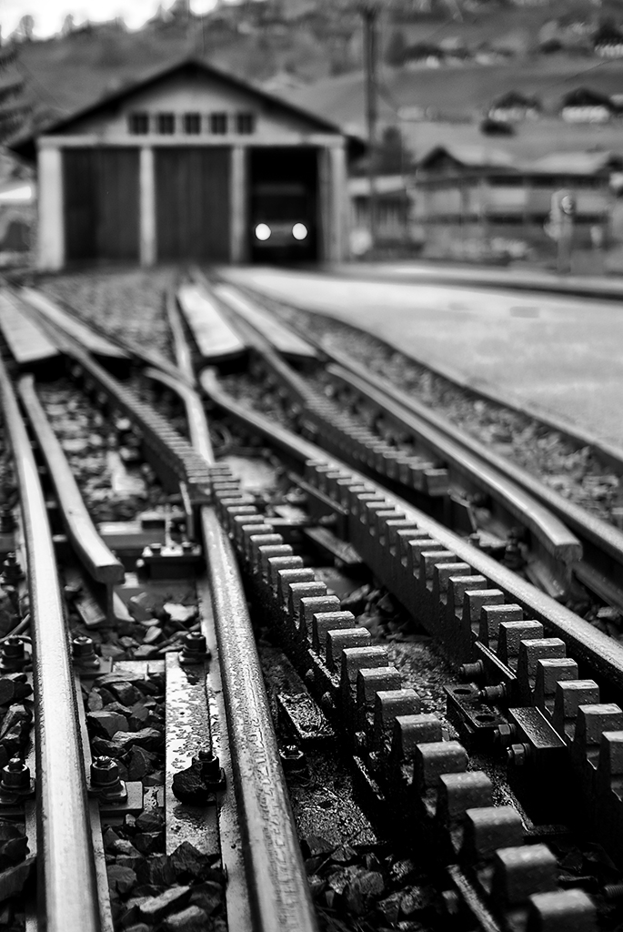 an old fashioned train track in a black and white po