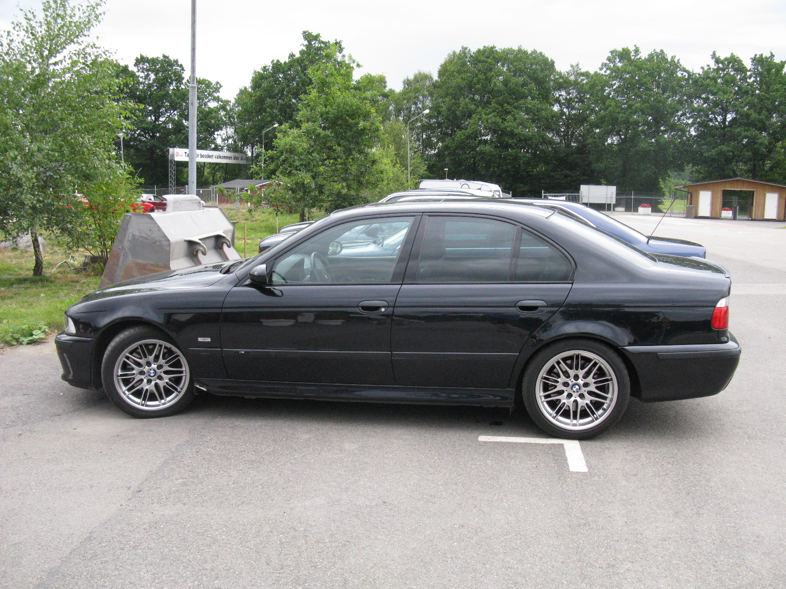 a black car parked in a parking space