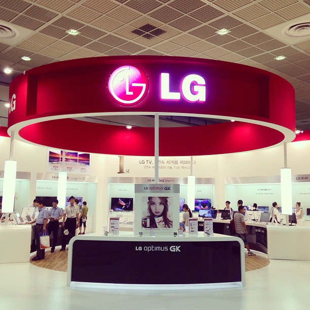 an lg store with people standing around and looking at their cell phones