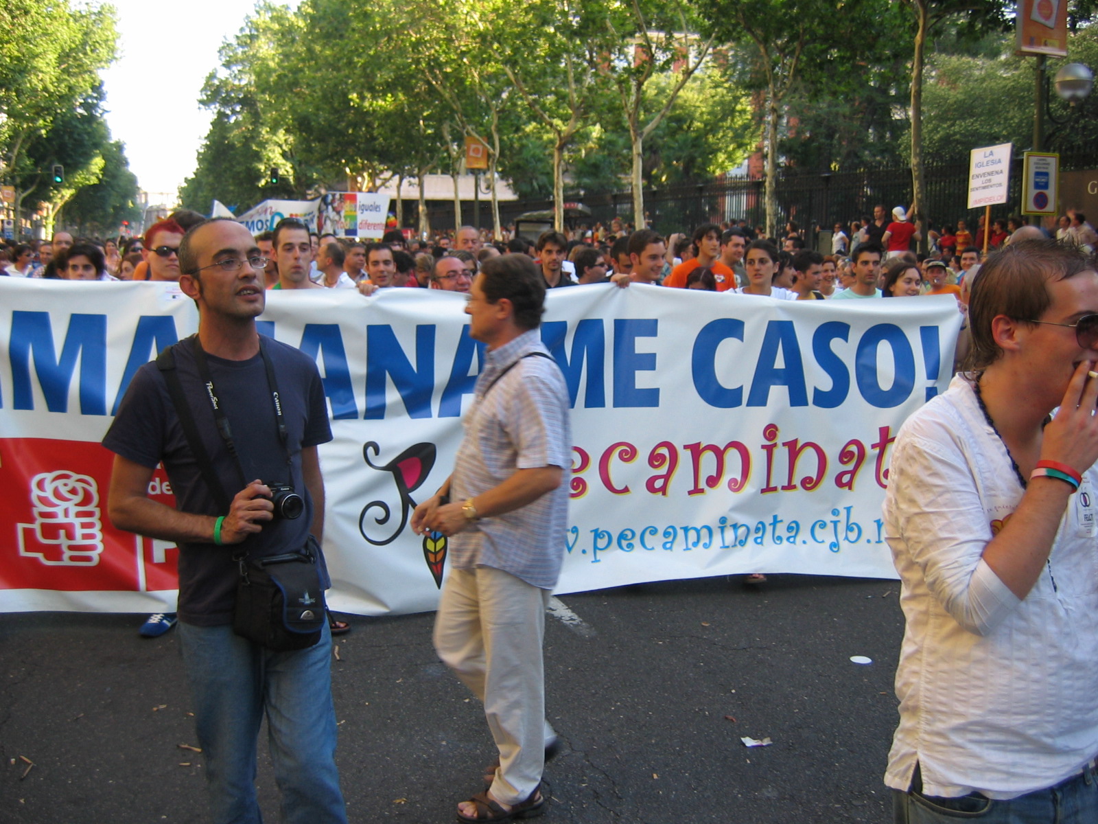 some people standing in front of a large banner