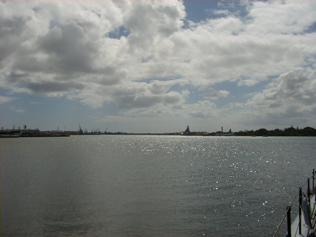 a view of the water and sky as seen from a pier