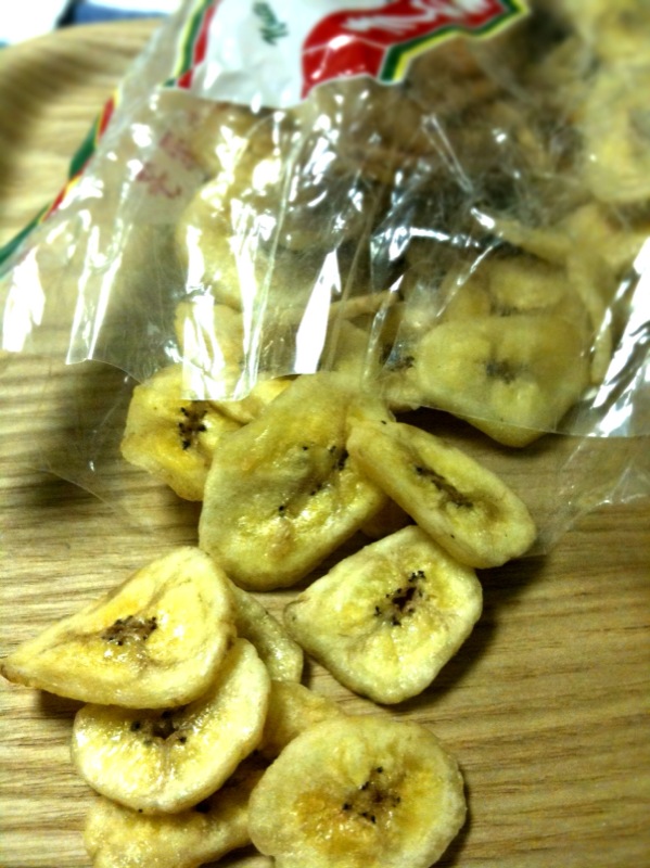 small bag full of bananas with a small bag sitting next to it