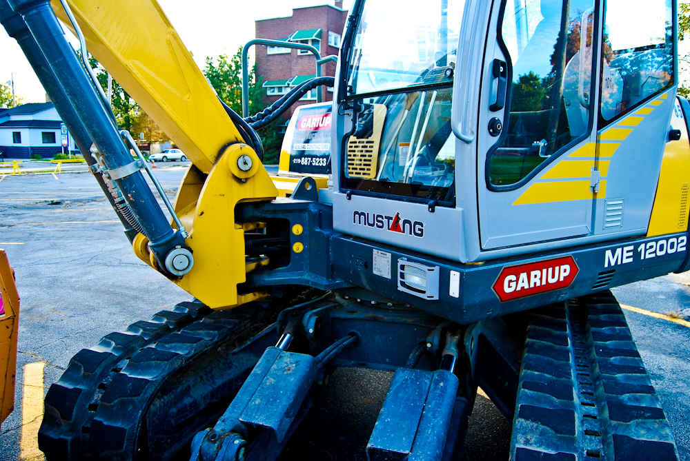 a construction vehicle sits on top of the ground