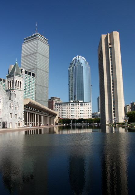a large lake in a city with high rise buildings